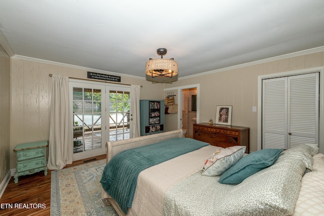 4225 W Lakeview Cir, Louisville, TN 37777 - bedroom featuring crown molding, wood finished floors, access to exterior, wood walls, and a closet