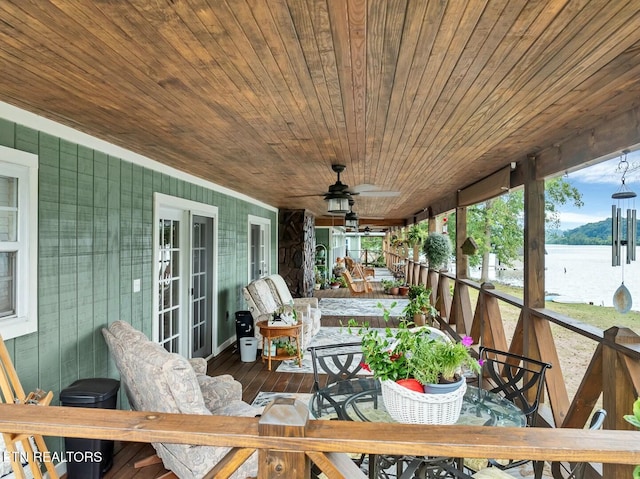 4225 W Lakeview Cir, Louisville, TN 37777 - sunroom / solarium featuring a ceiling fan, outdoor dining space, and a water view