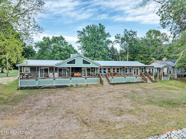 4225 W Lakeview Cir, Louisville, TN 37777 - rear view of property with metal roof, a porch, a deck, and view of scattered trees
