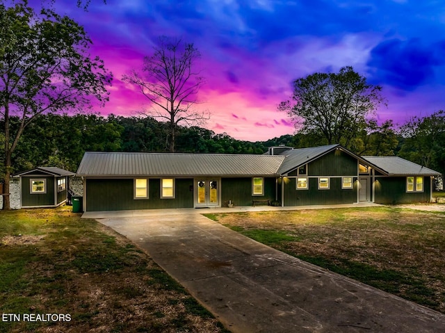 4225 W Lakeview Cir, Louisville, TN 37777 - ranch-style house featuring concrete driveway, metal roof, and board and batten siding