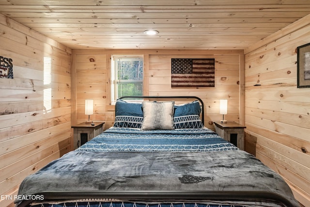 bedroom featuring wooden walls and wood ceiling