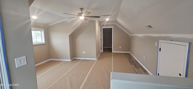 bonus room featuring wood finished floors, visible vents, ceiling fan, and vaulted ceiling