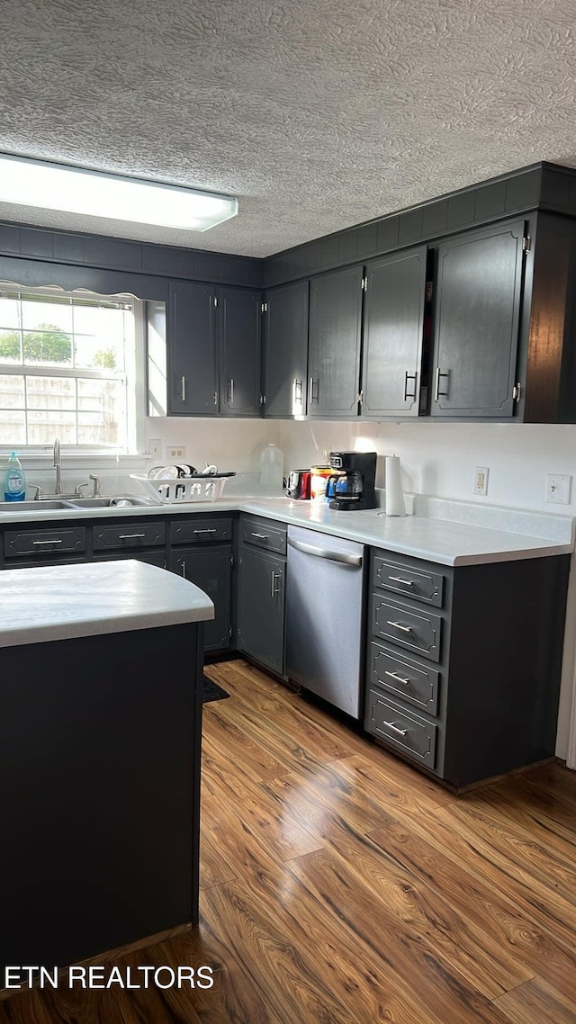 798 Lawson Rd, Crossville, TN 38571 - kitchen featuring stainless steel dishwasher, light countertops, a textured ceiling, and dark wood finished floors