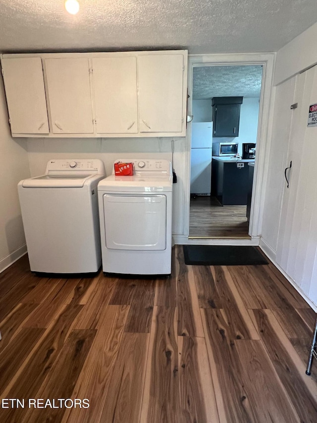 798 Lawson Rd, Crossville, TN 38571 - washroom featuring cabinet space, separate washer and dryer, dark wood-style flooring, and a textured ceiling