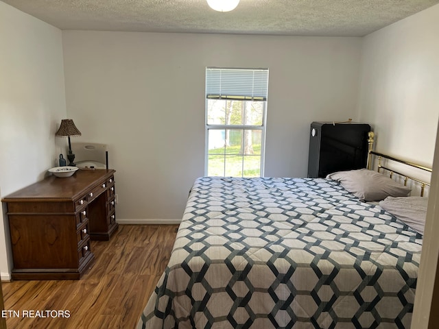 798 Lawson Rd, Crossville, TN 38571 - bedroom featuring wood finished floors and a textured ceiling