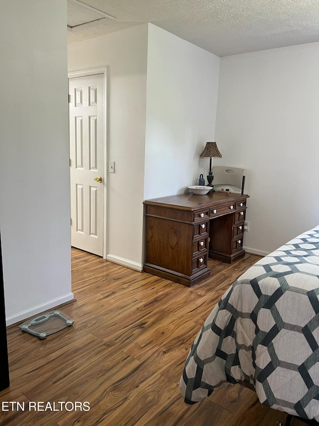798 Lawson Rd, Crossville, TN 38571 - bedroom with wood finished floors and a textured ceiling