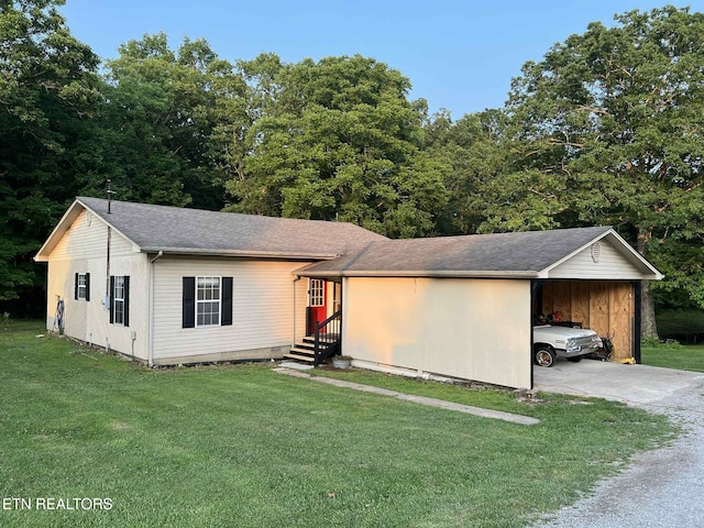 798 Lawson Rd, Crossville, TN 38571 - single story home featuring driveway, a front lawn, an attached carport, and roof with shingles