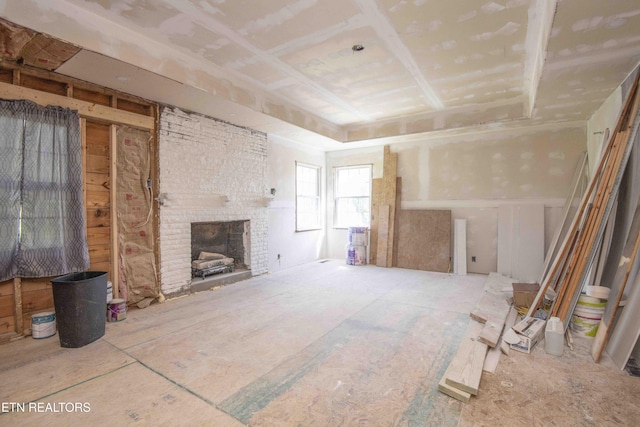1109 W Central Ave, Lafollette, TN 37766 - unfurnished living room with a brick fireplace