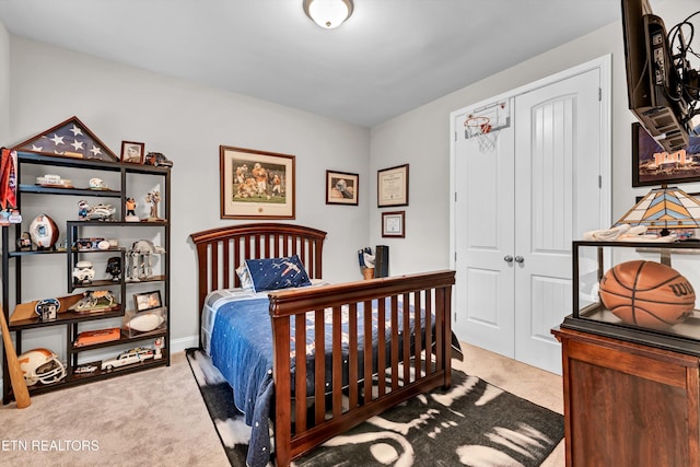 carpeted bedroom with a closet