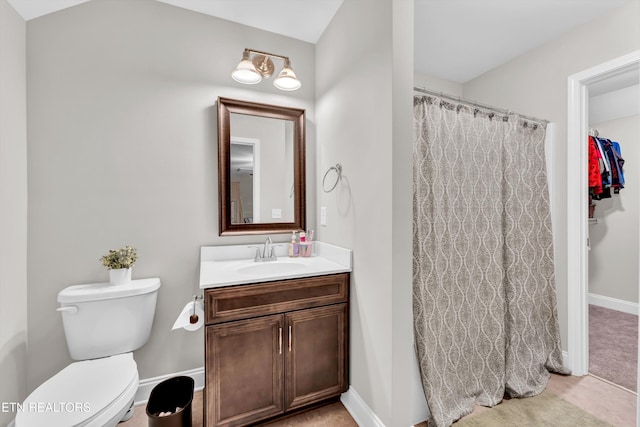 bathroom featuring baseboards, toilet, vanity, and a shower with curtain