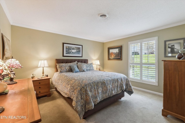 7914 Gleason Dr Unit 1145, Knoxville, TN 37919 - carpeted bedroom featuring a textured ceiling, baseboards, ornamental molding, and visible vents
