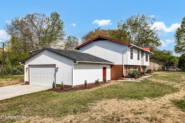 view of home's exterior with a yard, an attached garage, and concrete driveway