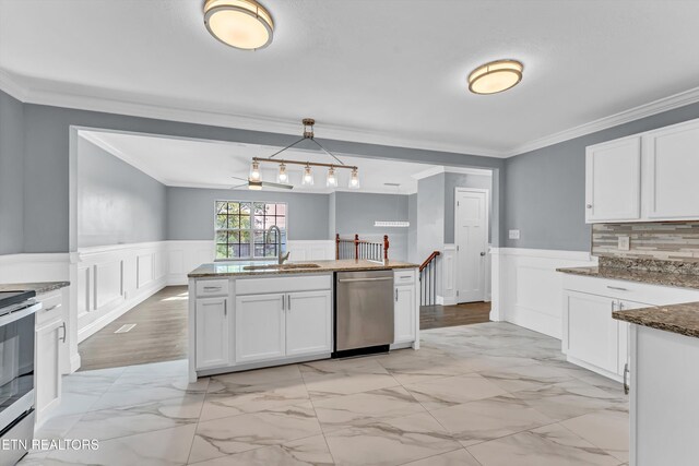 kitchen featuring white cabinets, marble finish floor, a sink, and appliances with stainless steel finishes