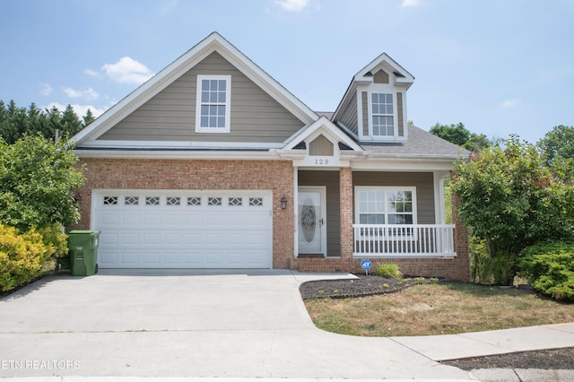 129 Mcneilly Cir, Maryville, TN 37803 - view of front of property with brick siding, covered porch, and driveway