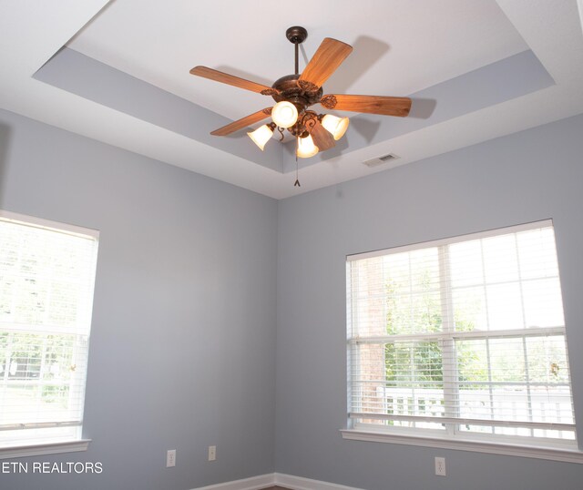 129 Mcneilly Cir, Maryville, TN 37803 - unfurnished room featuring visible vents, a tray ceiling, and ceiling fan