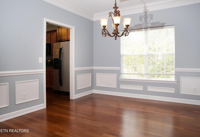 129 Mcneilly Cir, Maryville, TN 37803 - unfurnished dining area with a notable chandelier, crown molding, and dark wood finished floors