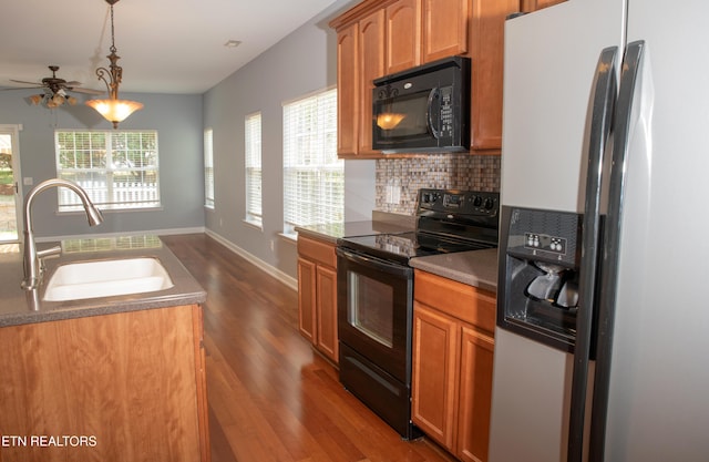129 Mcneilly Cir, Maryville, TN 37803 - kitchen with tasteful backsplash, a sink, a ceiling fan, dark wood finished floors, and black appliances