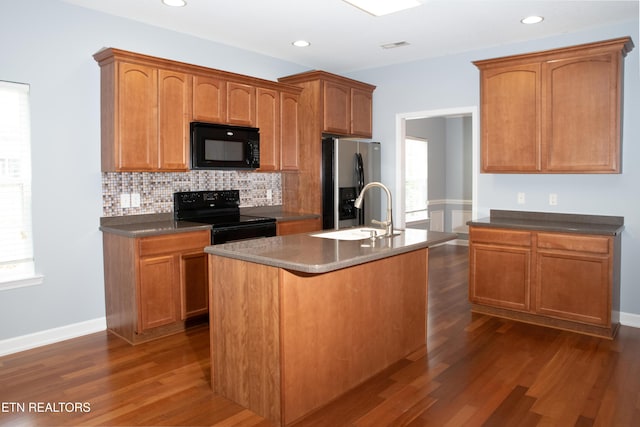 129 Mcneilly Cir, Maryville, TN 37803 - kitchen with a sink, a wealth of natural light, black appliances, and dark wood-type flooring