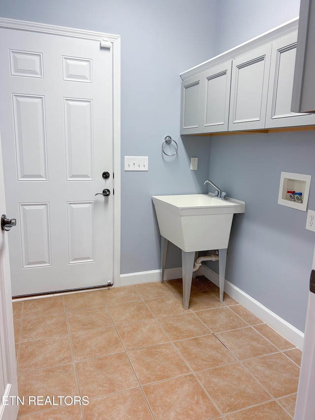 129 Mcneilly Cir, Maryville, TN 37803 - washroom featuring light tile patterned floors, baseboards, hookup for a washing machine, and cabinet space