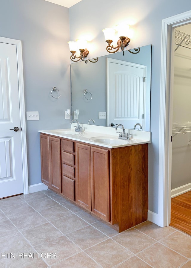 129 Mcneilly Cir, Maryville, TN 37803 - bathroom with a spacious closet, tile patterned floors, double vanity, and a sink