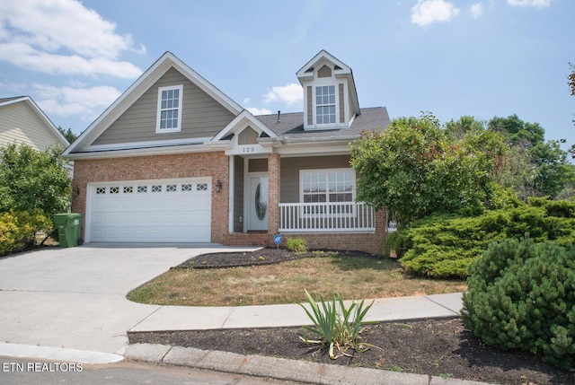129 Mcneilly Cir, Maryville, TN 37803 - view of front of home featuring brick siding, a porch, and concrete driveway