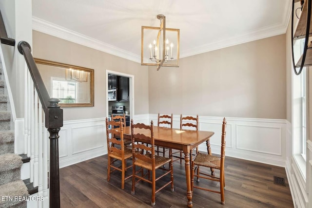 dining area with ornamental molding, an inviting chandelier, dark wood-style floors, and stairway