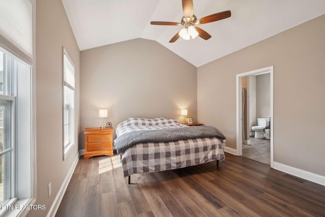 bedroom featuring multiple windows, wood finished floors, and vaulted ceiling