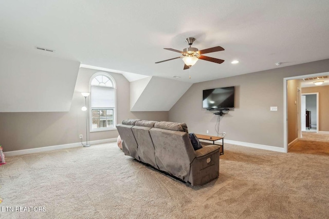 carpeted living room with vaulted ceiling, baseboards, a ceiling fan, and visible vents