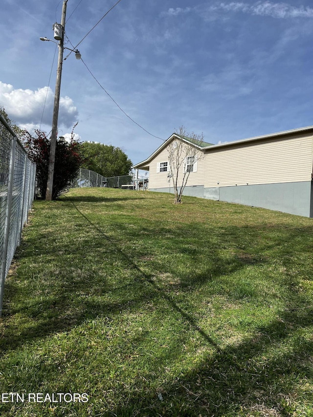 view of yard featuring fence