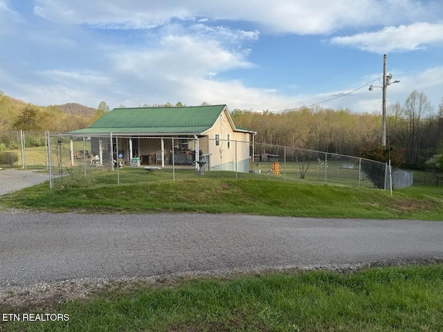 view of community with fence and a yard