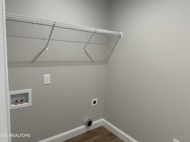 laundry room with baseboards, washer hookup, laundry area, dark wood finished floors, and hookup for an electric dryer