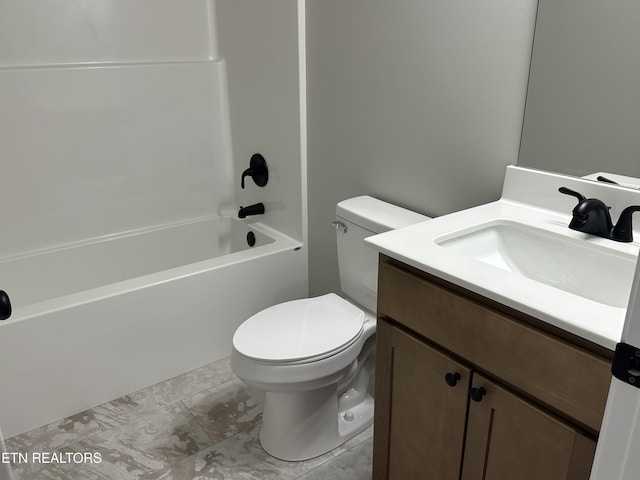 bathroom featuring vanity, shower / tub combination, and toilet