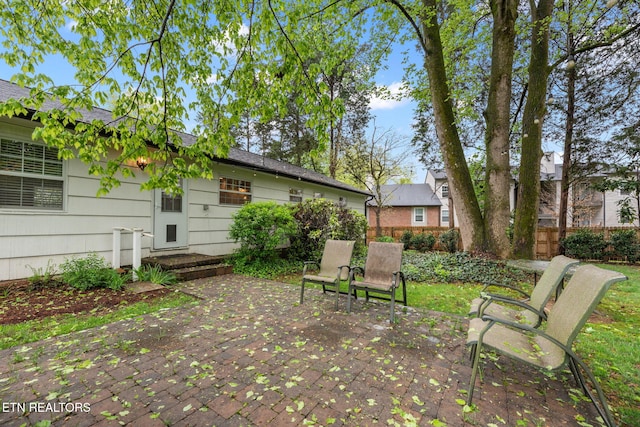 view of yard featuring a patio and fence