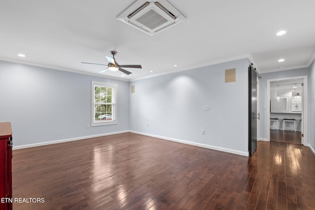 empty room featuring recessed lighting, dark wood-style floors, ornamental molding, and a ceiling fan