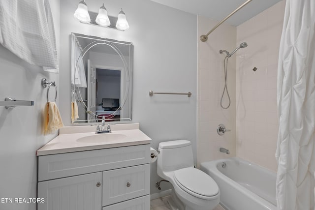 bathroom featuring shower / tub combo, toilet, and vanity