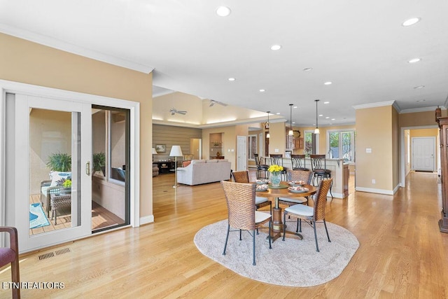 dining room featuring visible vents, ornamental molding, baseboards, and recessed lighting