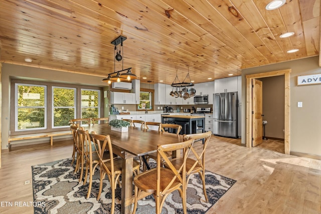 dining room featuring light wood-style flooring, recessed lighting, and wood ceiling