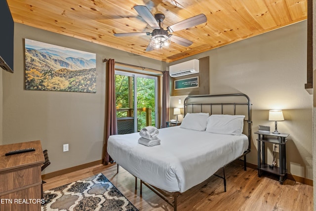 bedroom featuring wood ceiling, a wall unit AC, baseboards, and light wood-type flooring