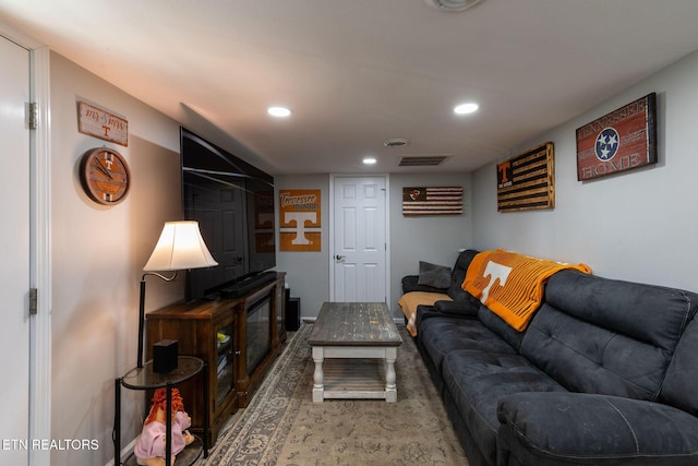 living area featuring recessed lighting and visible vents