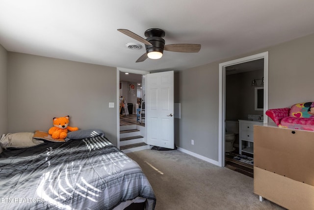 carpeted bedroom with visible vents, baseboards, and ceiling fan