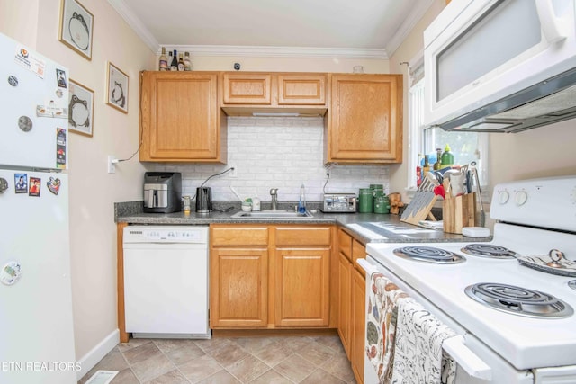 kitchen featuring crown molding, a sink, white appliances, and backsplash