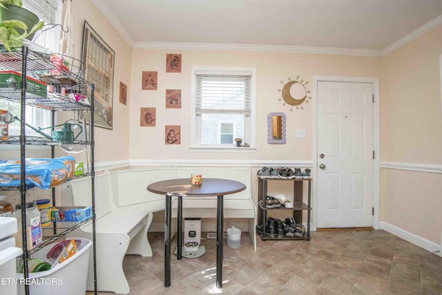 dining area with baseboards and ornamental molding