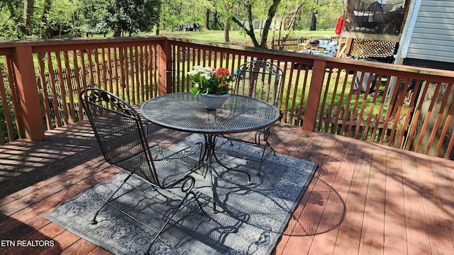 deck with outdoor dining area