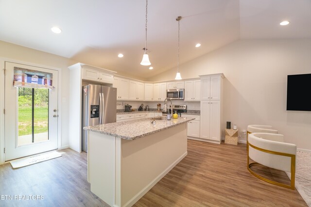 5925 Knox Hill Way, Knoxville, TN 37912 - kitchen featuring light wood-style floors, vaulted ceiling, white cabinetry, and stainless steel appliances