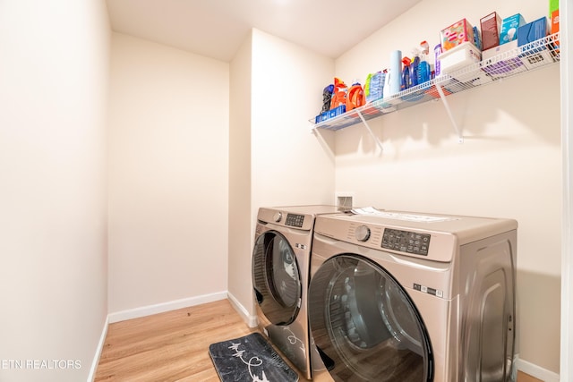 5925 Knox Hill Way, Knoxville, TN 37912 - laundry area featuring baseboards, washing machine and clothes dryer, laundry area, and light wood-style flooring