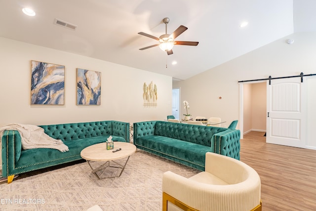 5925 Knox Hill Way, Knoxville, TN 37912 - living room with a barn door, vaulted ceiling, wood finished floors, ceiling fan, and visible vents