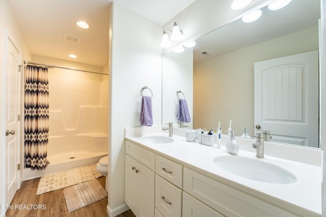 5925 Knox Hill Way, Knoxville, TN 37912 - full bathroom featuring a shower stall, wood finished floors, a sink, and visible vents