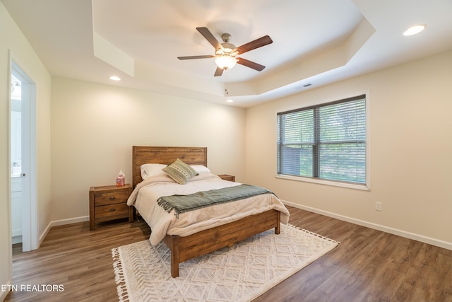 5925 Knox Hill Way, Knoxville, TN 37912 - bedroom with wood finished floors, ceiling fan, a tray ceiling, baseboards, and recessed lighting