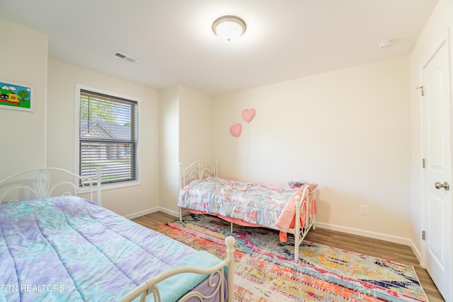 5925 Knox Hill Way, Knoxville, TN 37912 - bedroom with baseboards, wood finished floors, and visible vents