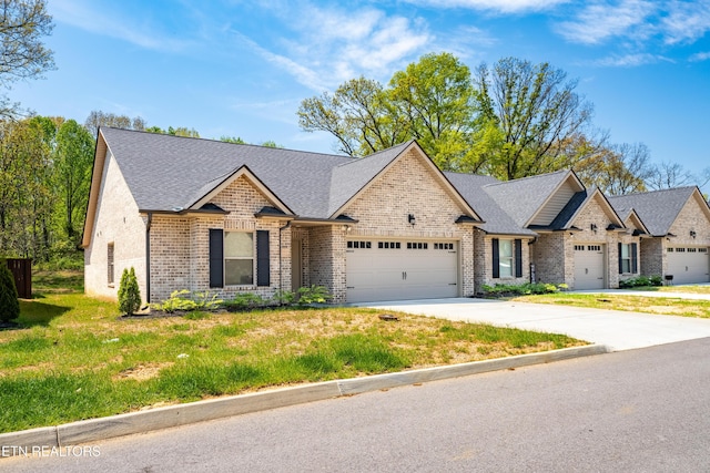 5925 Knox Hill Way, Knoxville, TN 37912 - view of front of property featuring concrete driveway, a front lawn, a shingled roof, a garage, and brick siding